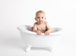 Baby in a white bathtub